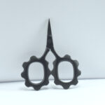 Black sunflower-shaped embroidery scissors, 2.5" forged stainless steel with powder coating, ideal for thread cutting and detailed stitching work.