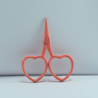 2.5-inch peach-colored heart-shaped embroidery scissors made of stainless steel, perfect for detailed thread cutting and fine needlework.