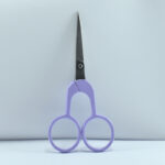 4-inch Rainbow Style embroidery scissors with electric lavender half-color powder-coated handle and stainless steel blade, ideal for thread cutting and needlework.